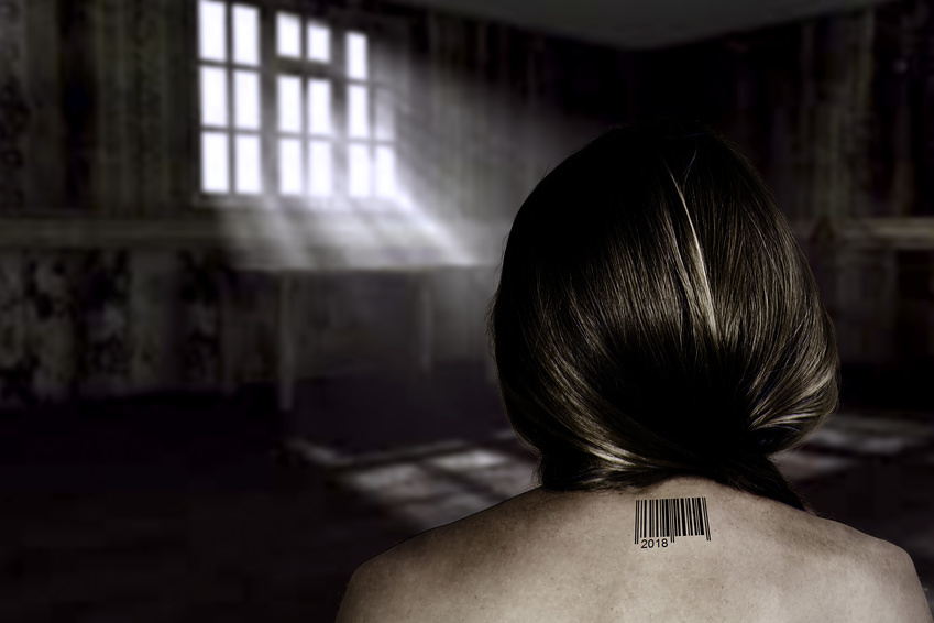 The concept of trafficking in people with a naked female back and barcode