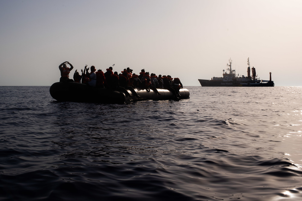 At the first light on August 23, the Sea-Watch 4 morning look out spotted a small black vessel in international waters, some 31 nautical miles from the coast of Libya. The overcrowded and unseaworthy rubber boat carried 60 men and women, as well as 9